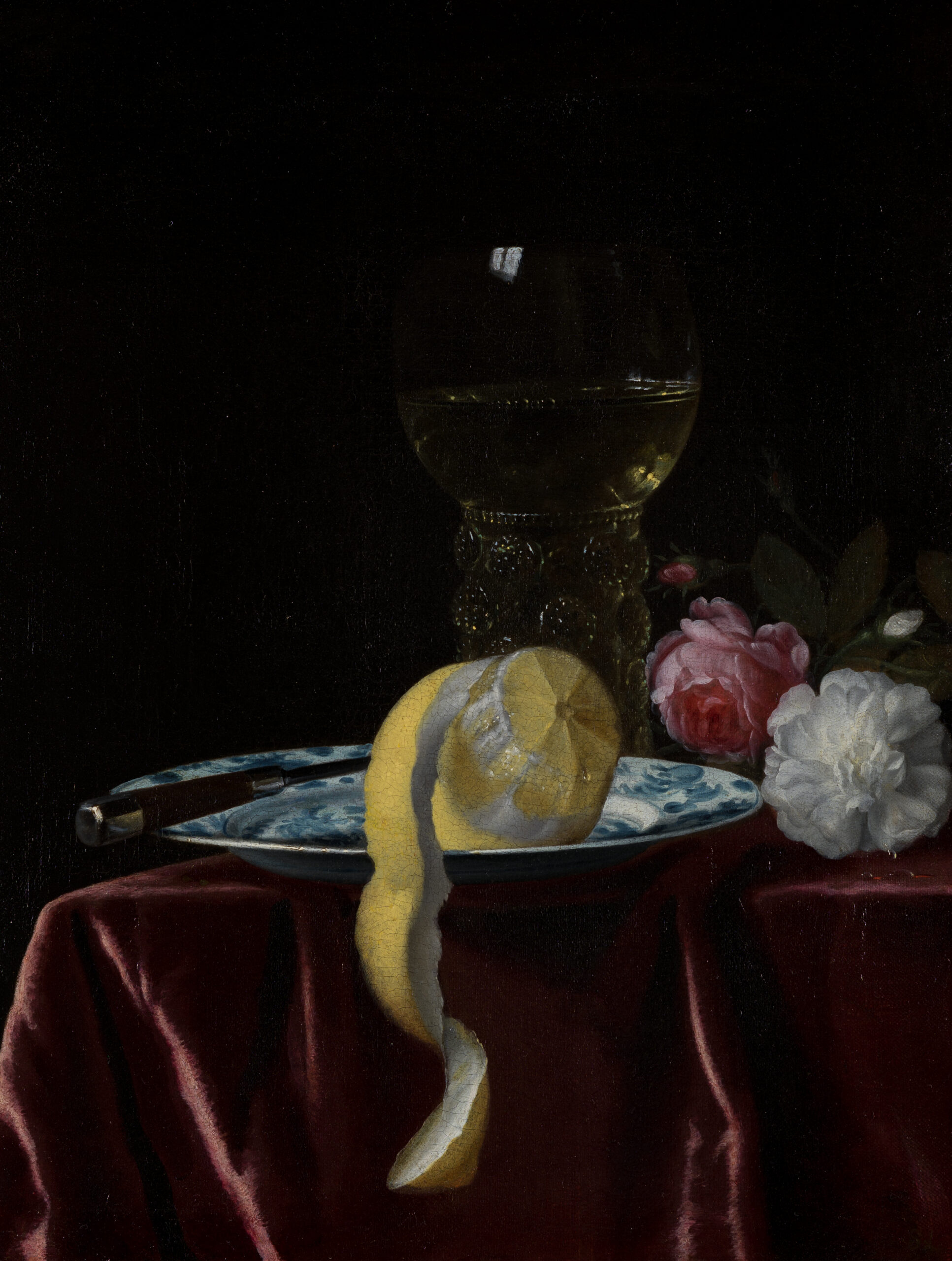 Simon Luttichuys, A Still Life of a Roemer and a Lemon together with a Knife on a Wanli Kraak Porcelain Plate, and Roses on a draped Table - Rafael Valls